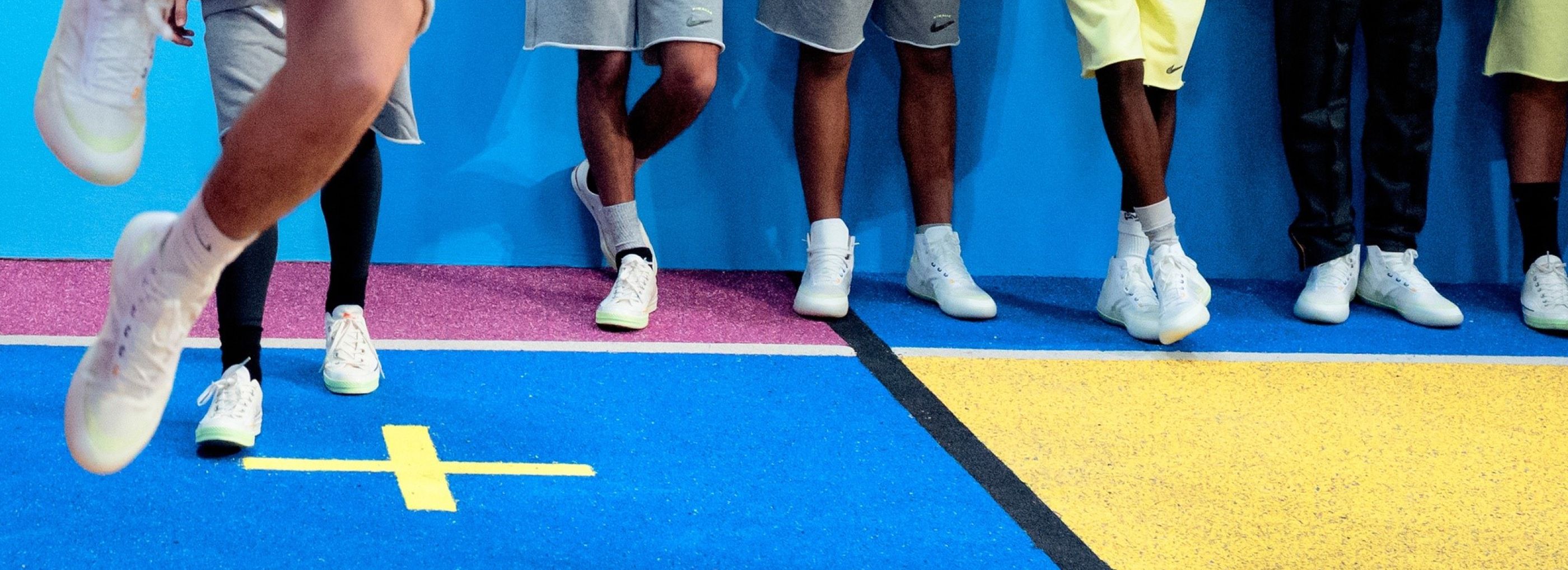 Outdoor basket court with a red floor in a school.