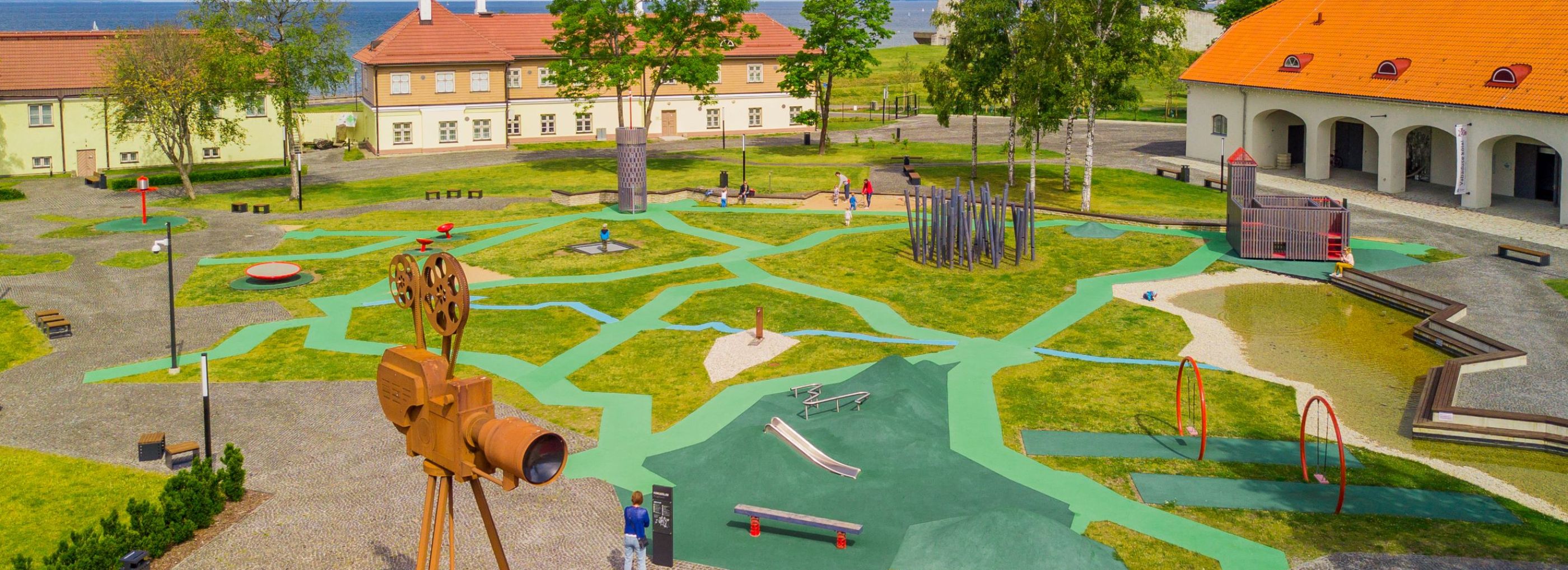 Green walkway path in a playground.