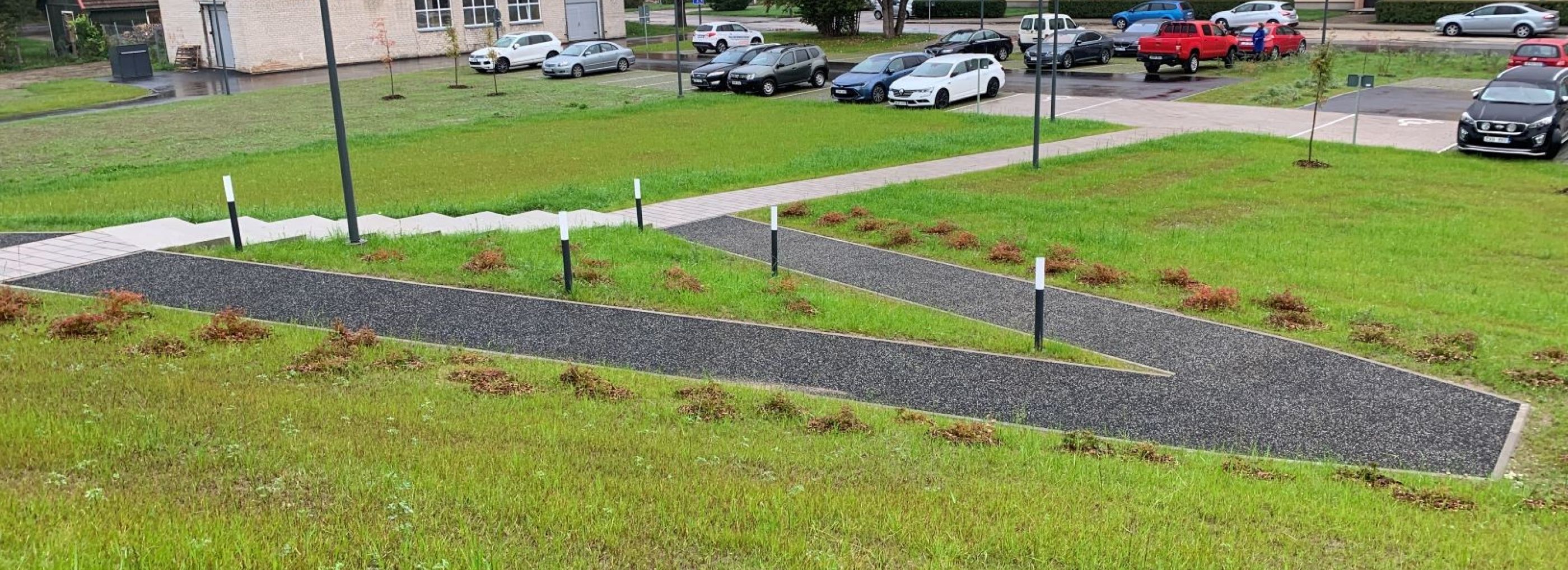 Rubber pathway down a grassy bank.